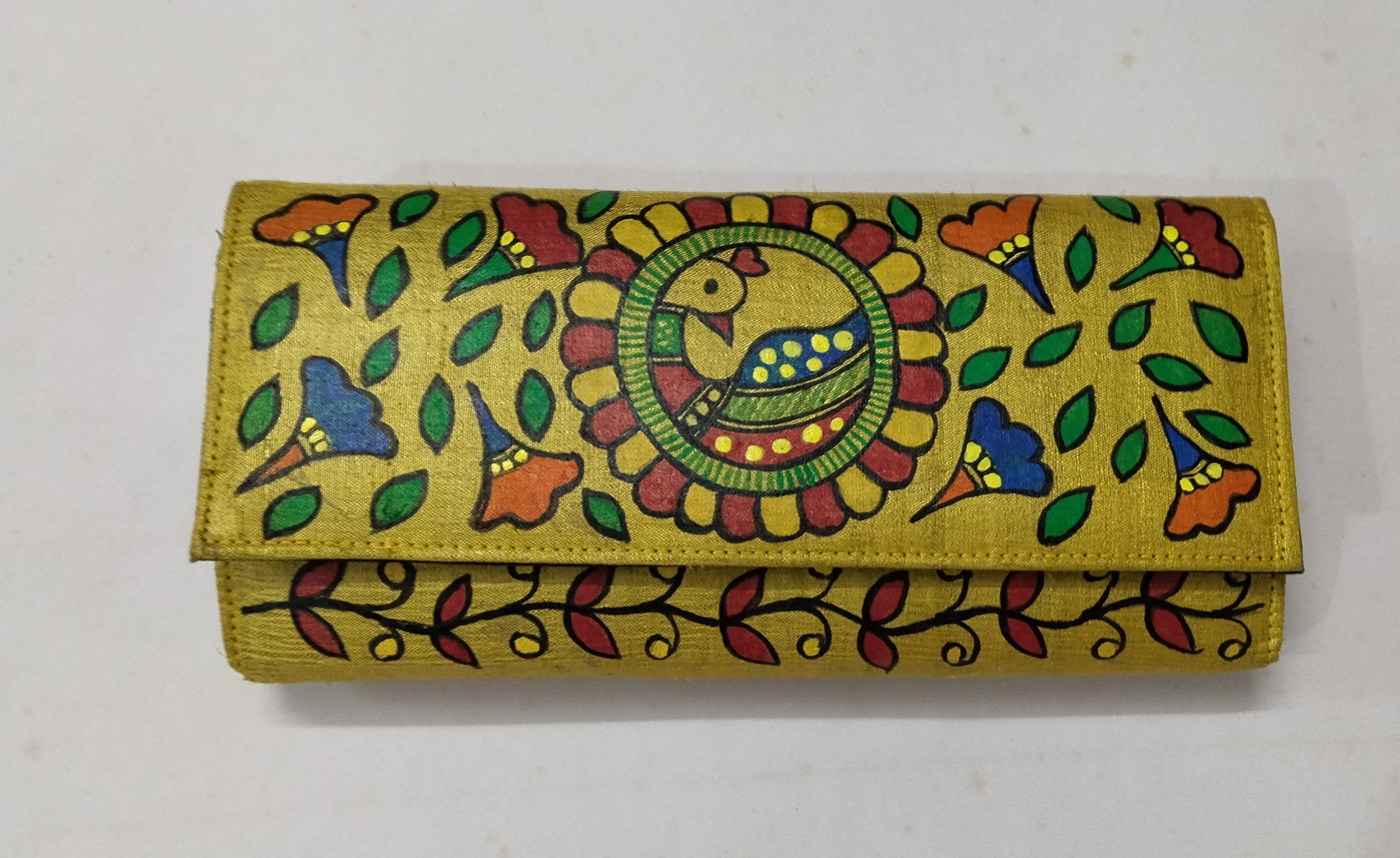 “Golden Mithila Glow: Handcrafted Madhubani Silk Clutch”