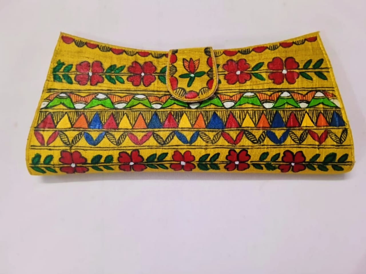 Golden Grace Flap Clutch – elegant, memorable, and suitable for a handcrafted product.