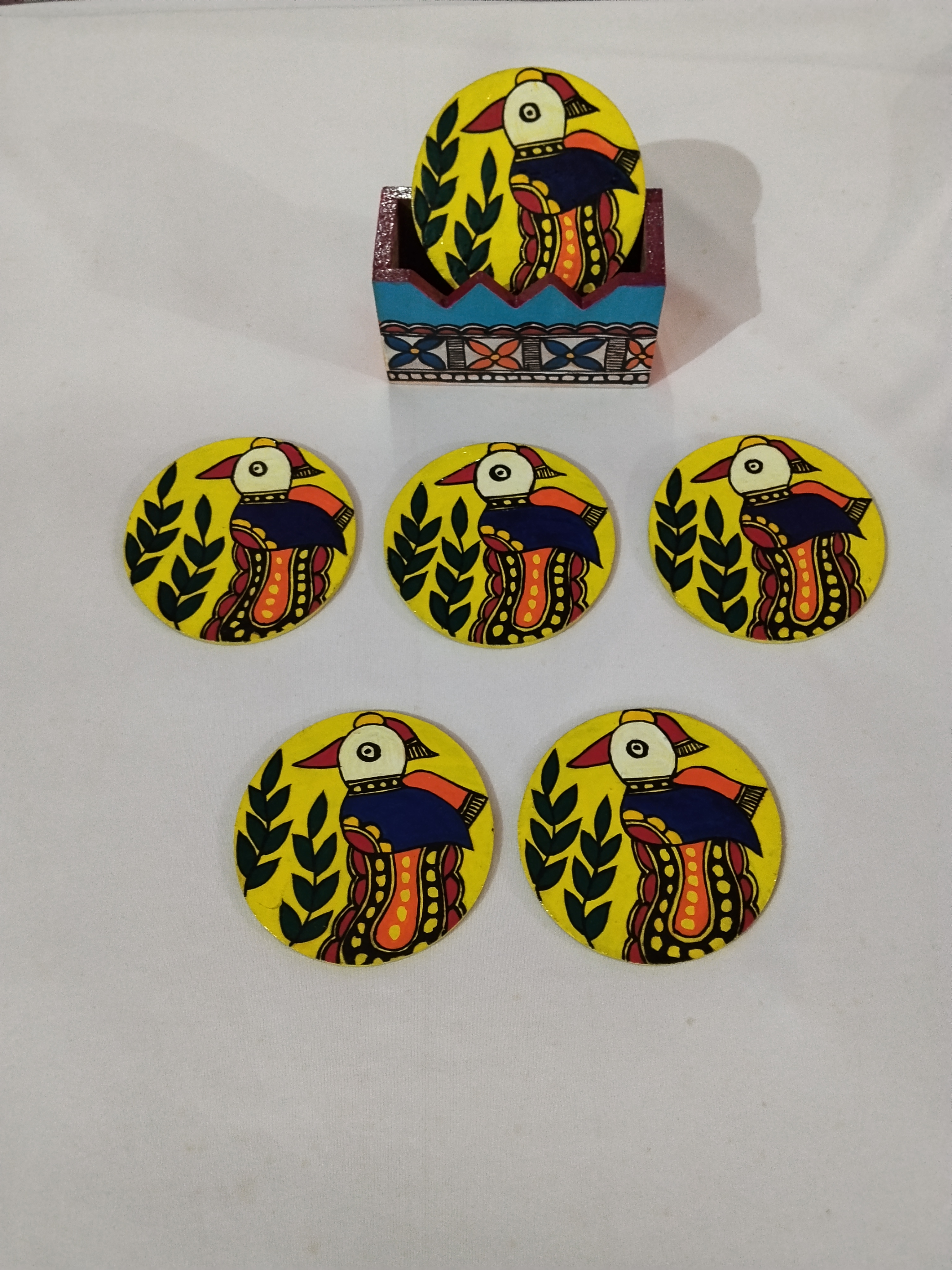 “Mithila Elegance: Hand-Painted Madhubani Wooden Tea Coasters”